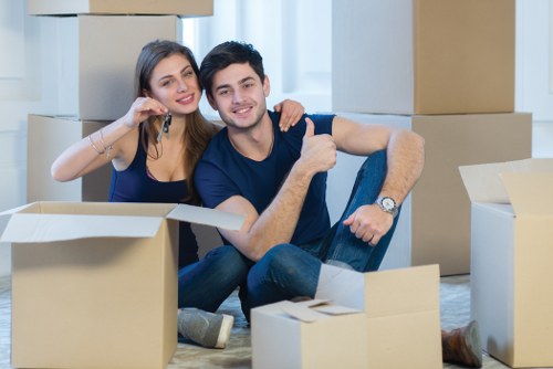 Moving boxes and furniture in a Hendon apartment building