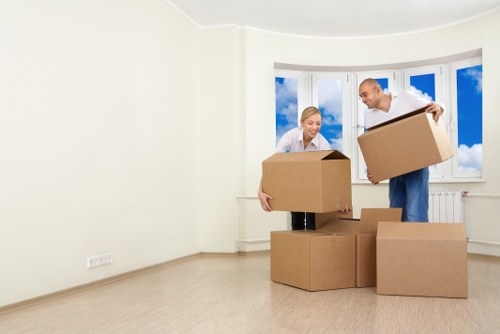 Packed office furniture and labelled boxes ready for a Hendon move