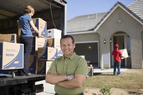 Customer moving boxed items using safe handling practices